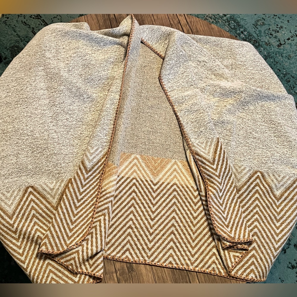 Cozy shawl with fun design along the bottom